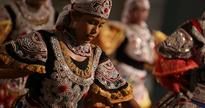 Sri Lankan child engaging in a traditional dance in Sri Lanka