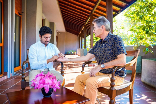 a doctor identifying dosha using the science of pulse ( Nadi Vignana )